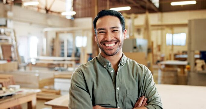 Business, man and carpenter portrait in workshop, happy and proud confident Asian male person in carpentry trade company. Craftsmanship, wood product and timber manufacturer with arms crossed