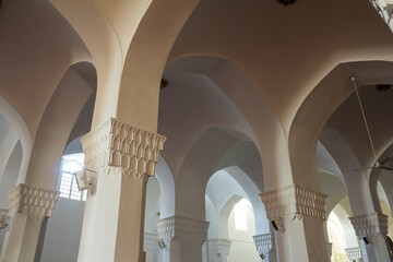 Interior of Molla Esmail Mosque in Yazd, Iran with perfect details of plasterwork on arches and...