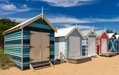 Beautiful bathing houses on white sandy beach at Brighton in Melbourne, Australia.