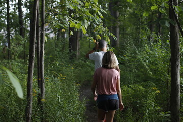 Couple hiking in the forest - 778370884