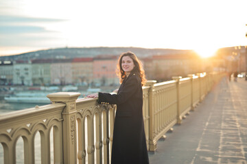 young woman on a bridge in Budapest - 778387424