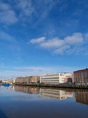 A beautiful view on the shore of Aura river on a sunny spring day. Turku, Finland