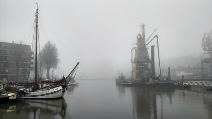 Foggy view of a canal in Rotterdam, Netherlands