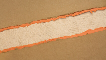 paper abstract in orange and pumpkin tones with a copy space - sheets of handmade paper, blank web banner - 778400223