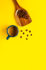Flat lay composition with coffe cup with espresso coffee  and wooden spoon with beans. - 778400431