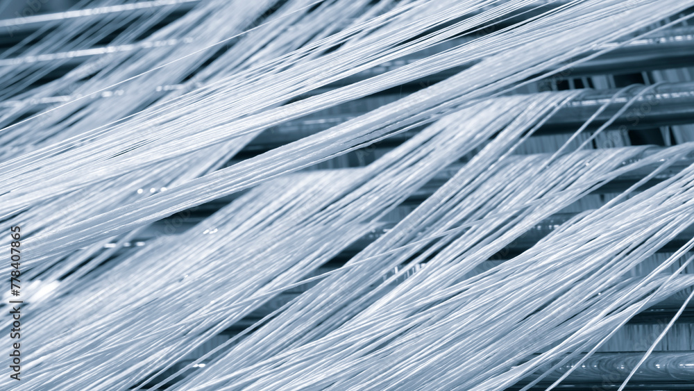 Aufkleber A close up of a bunch of white threads. Concept of calmness and serenity, as the threads are arranged in a neat and orderly manner