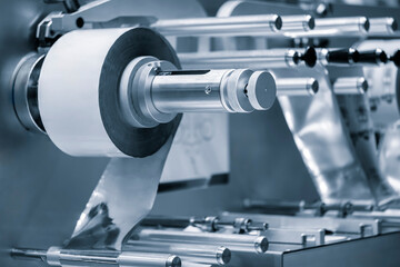 Automatic polyethylene air-bubble packaging roll tape film machine with lighting effect in blue background in full screen