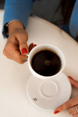 Girl's hands
hands in pockets
manicure
Cup of coffee