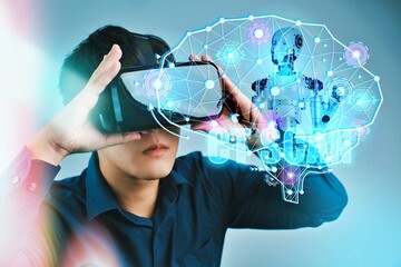 A man is wearing a blue shirt and holding a virtual reality headset. The image is of a brain with a robot inside of it. Scene is futuristic and technological Concept of AI  tech trends.