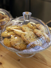 crispy cookies with chocolate pieces in a glass bowl