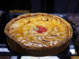 apple pie with puff pastry and cherries