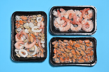 Plastic packages with seafood - 778418889