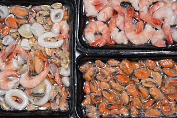 Plastic packages with seafood - 778419068