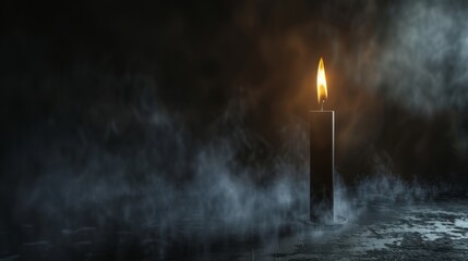 black candle on a dark background with fog. - obrazy, fototapety, plakaty
