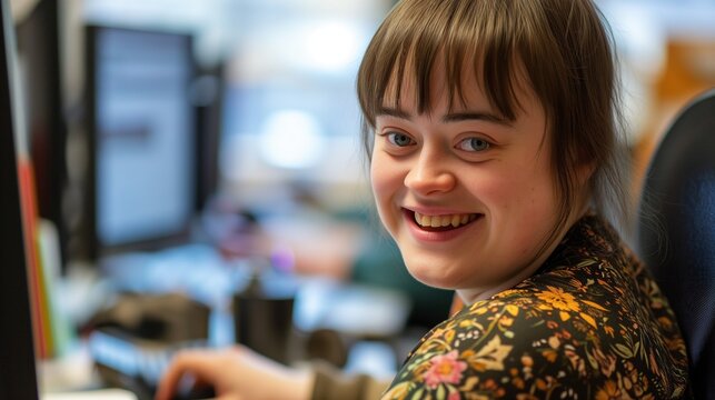 Portrait of an active, smiling working person with Down's syndrome, disabled woman with lovely face and beautiful expression looking at the camera, nice photograph of an employee with handicap at work