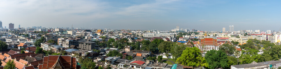 Fototapeta na wymiar Traditional Thai Architecture with Modern Buildings and Skyscrapers in Background. Cityscape of Bangkok, Thailand as Seen from Temple of the Golden Mount (Wat Saket).