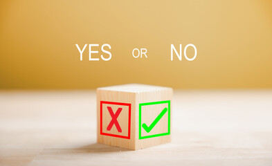 Green check mark and red x on wooden block signify decision making. Choice concept presented. Think...