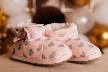 Soft pink slippers with silver hearts