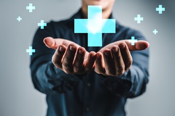 A man is holding a blue cross with a white star in his hands. Concept of hope and healing