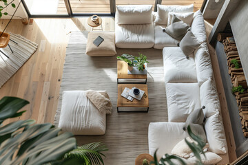 Airy Scandinavian Living Room. View from the second floor of a Scandinavian-style living room with plush white sofas, wooden accents, and indoor plants, bathed in natural light - obrazy, fototapety, plakaty