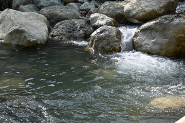 Naklejka na ściany i meble rock and stones in the river