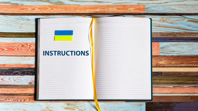 Notepad with the word INSTRUCTIONS on a vintage background. concept of obeying or reading instructions