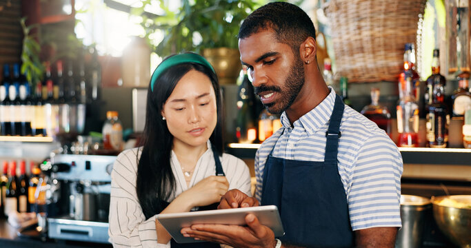 Tablet, restaurant bartender and team discussion on alcohol stock, store trade or bar inventory in startup business. Planning, hospitality service and entrepreneur cooperation on drinks supply chain