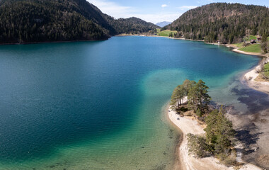 Aerial drone shot of stunning Hintersteiner See with incredible turquoise water, surrounded by the majestic Austrian Alps