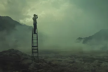 Rolgordijnen A man stands on a ladder using binoculars to search the horizon in a foggy mountain landscape. Man on Ladder Searching in Foggy Mountains © Оксана Олейник