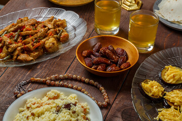 Shabbat table for a family dinner with traditional holiday dishes and drinks