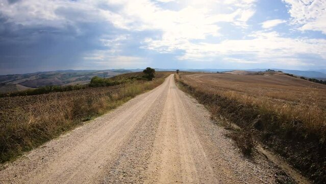 Via Francigena - gravel road in the countryside near Torrenieri, Montalcino, Province of Siena, Tuscany, Italy