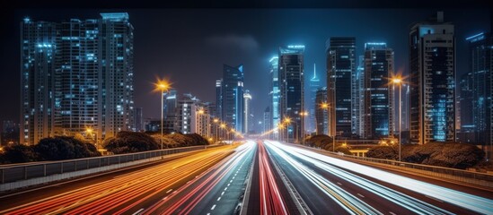 Fototapeta na wymiar Cars lights on the road of modern city at night time