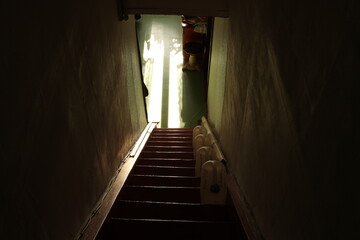 Stairs down in old house and contrasting sunlight. Photo was taken 21 March 2024 year, msk time. - 778474462
