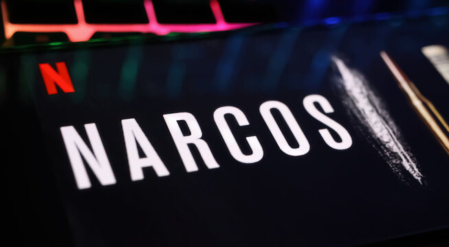 Viersen, Germany - April 3. 2024: Netflix series Narcos cover poster on smartphone screen on computer keyboard