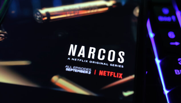 Viersen, Germany - April 3. 2024: Netflix series Narcos cover poster on smartphone screen on computer keyboard