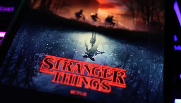 Viersen, Germany - April 3. 2024: Netflix series Stranger things cover poster on smartphone screen on computer keyboard