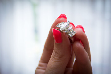 Pink nails and a diamong ring