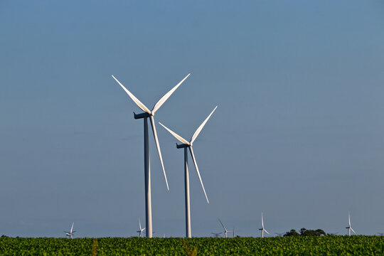 Only the Wind turbines stand tall above the farmlands , Lucknow, ON, Canada