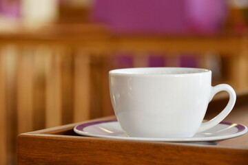 Taza de Café sobre una mesa de madera.