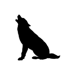 The silhouette of a wolf howling at the moon