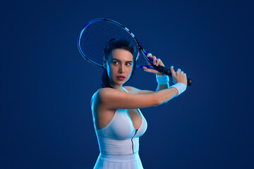 Tennis player woman with racket on tournament. Girl athlete with tenis racket on open court with neon colors. Sport concept. Download a high quality photo for design of a sports app or tour events. - 778503407