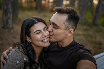 Fototapeta premium Man and woman young adult couple in nature self portrait selfie ugc