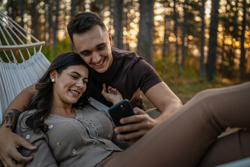 Man and woman young adult couple in nature self portrait selfie