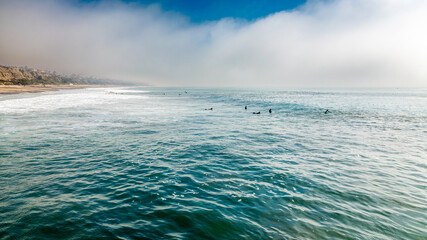 Surfers Waiting for the Next Set of Waves Off the San Clemente Coastline - obrazy, fototapety, plakaty