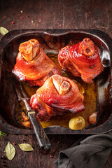 Tasty and grilled Schweinshaxe made of raw meat. - obrazy, fototapety, plakaty