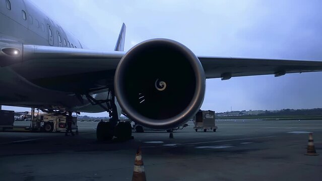 Front View of the Engine of A Passenger Airplane at Sunset. 4K Resolution.