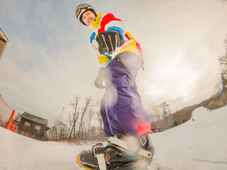 A daring man conquers snowy slopes with style, showcasing skill and thrill as he maneuvers on a...