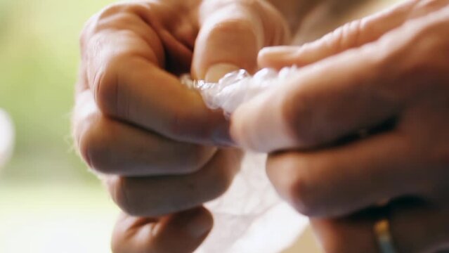 Male Hands Playing with Bubble Wrap for Relaxation - Close Up - 4K
