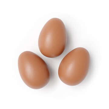 Three Brown Eggs Textured White Background with Shadow Close-up