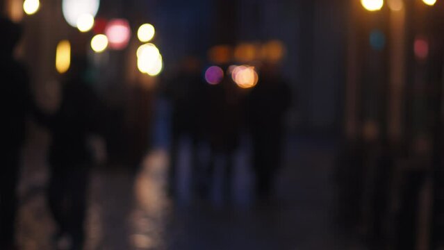 Nighttime impressions: Defocused footage offers a poetic glimpse into the city at night, with rain-soaked streets and blurred figures evoking a sense of urban enchantment and intrigue.